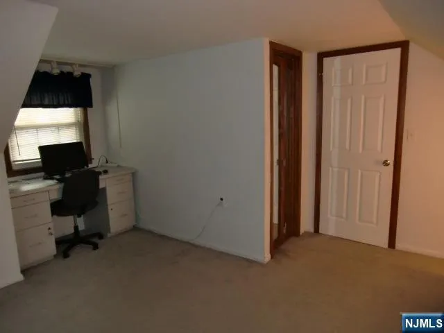 a utility room with cabinets washer and dryer