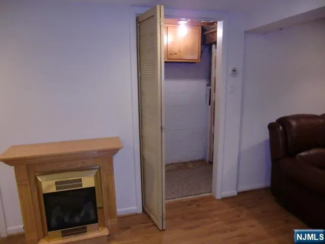 a view of a yard with wooden fence