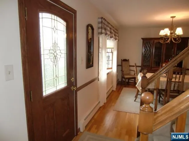 a view of a livingroom with furniture stairs