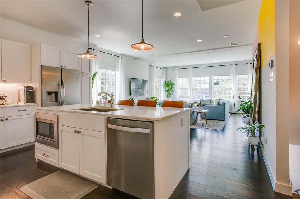 603 Finley Court Dallas, TX 75208 - Photo 11 of 40 a kitchen with a white cabinets stove and refrigerator