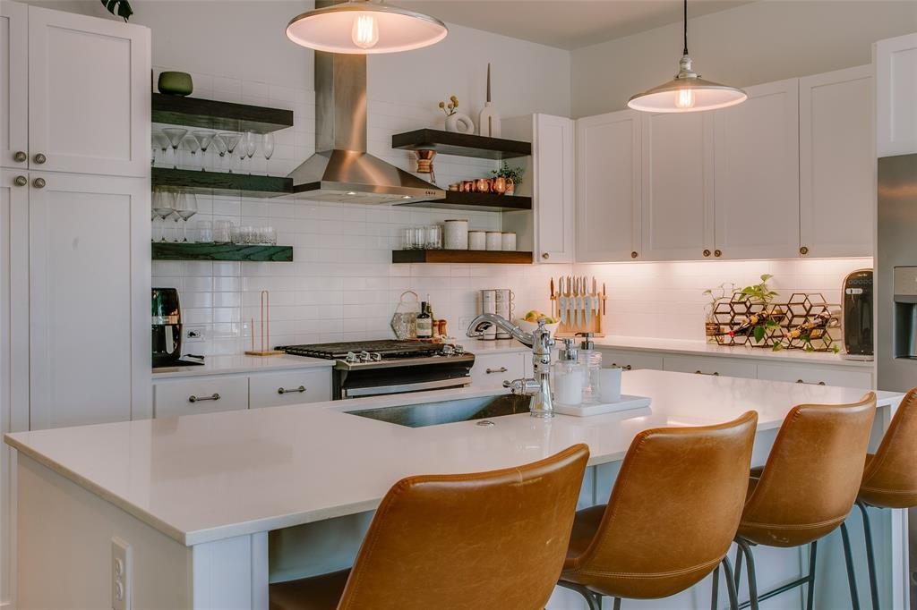 603 Finley Court Dallas, TX 75208 - Photo 8 of 40 a kitchen with stainless steel appliances granite countertop a sink a stove and a refrigerator