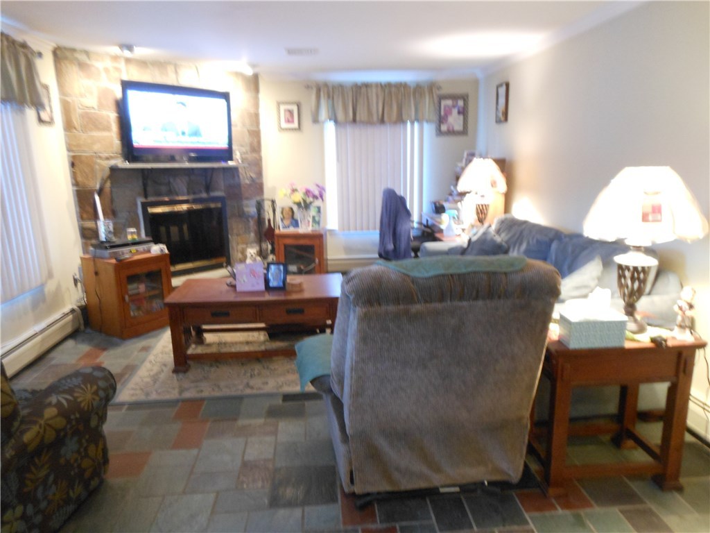 17 Hawthorne Road Smithfield, RI 02828 - Photo 17 of 22 Living room with wood burning fireplace