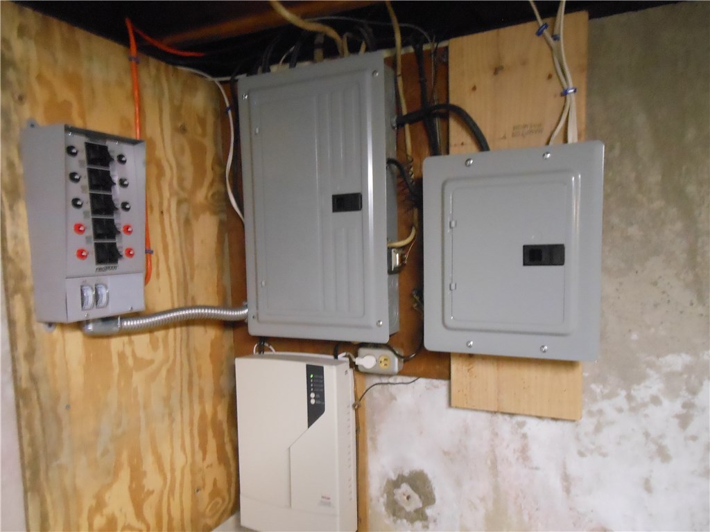 17 Hawthorne Road Smithfield, RI 02828 - Photo 21 of 22 Main breaker system with generator hook up backfeeed