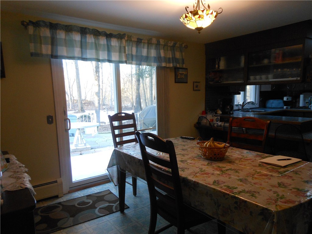 17 Hawthorne Road Smithfield, RI 02828 - Photo 8 of 22 Dining area in kitchen with sliders to patio