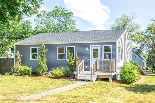 a view of house with outdoor space and garden