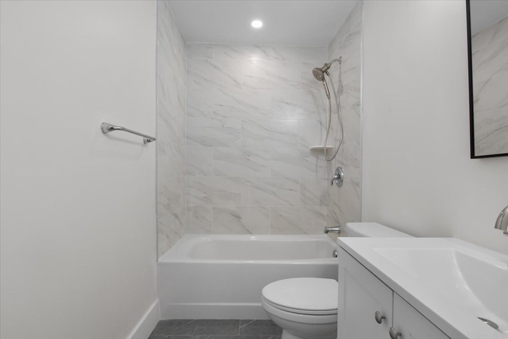 3 Cummings Circle Randolph, MA 02368 - Photo 14 of 39 a bathroom with a toilet and a bath tub