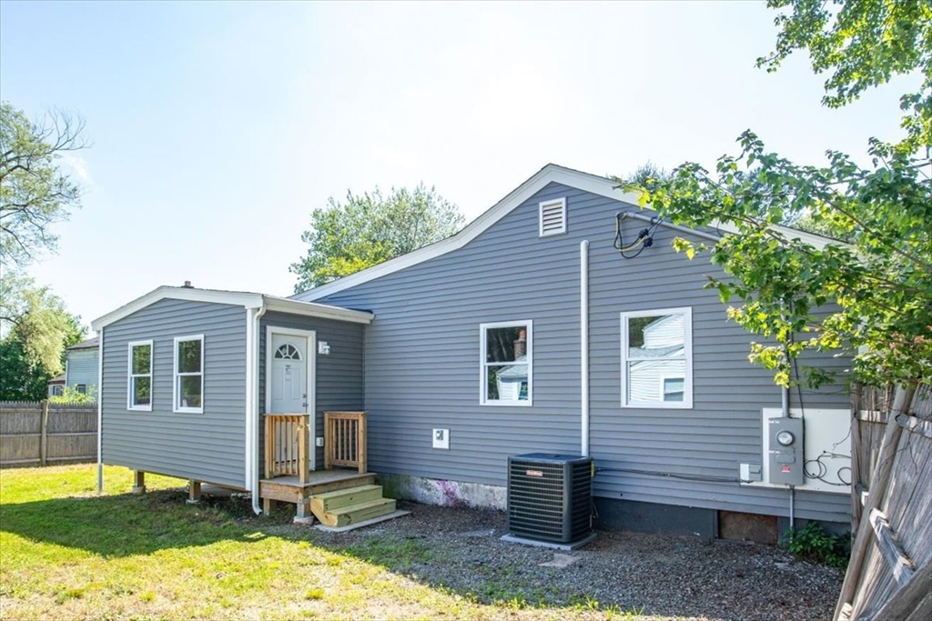 3 Cummings Circle Randolph, MA 02368 - Photo 36 of 39 a front view of a house with a yard