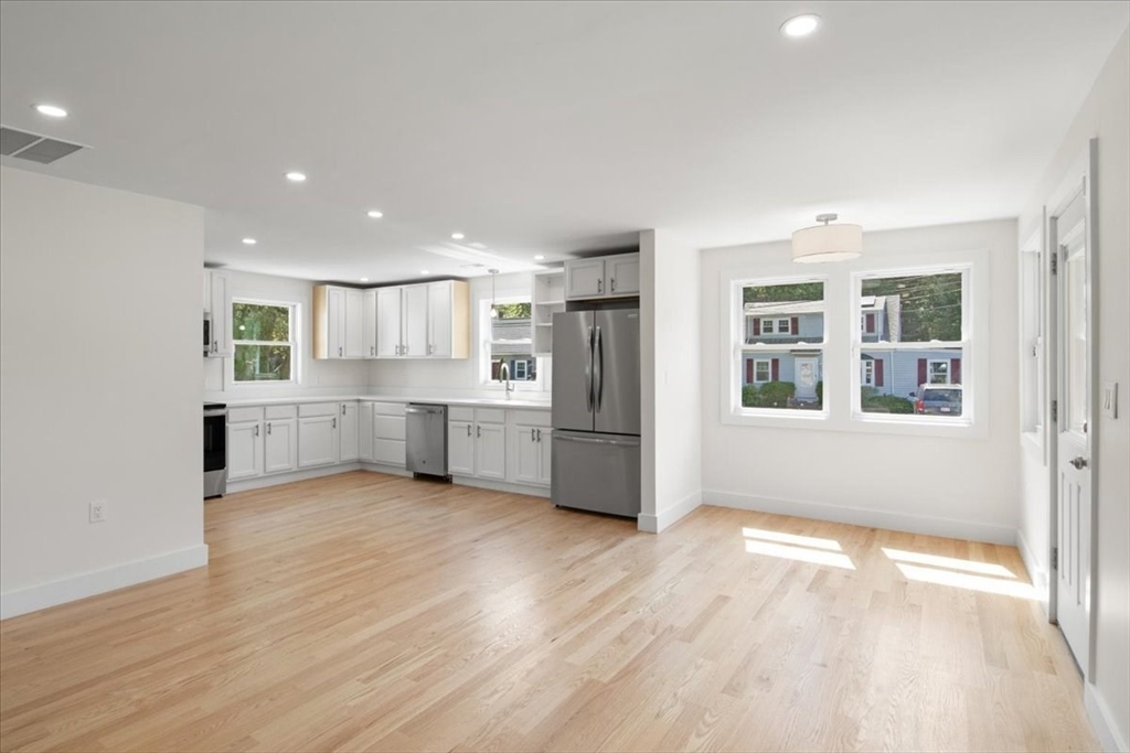 3 Cummings Circle Randolph, MA 02368 - Photo 4 of 39 a view of a kitchen with wooden floor and windows