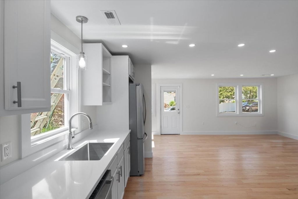 3 Cummings Circle Randolph, MA 02368 - Photo 8 of 39 a kitchen with granite countertop a sink and window