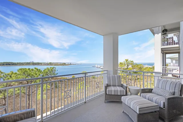 a balcony with furniture and city view