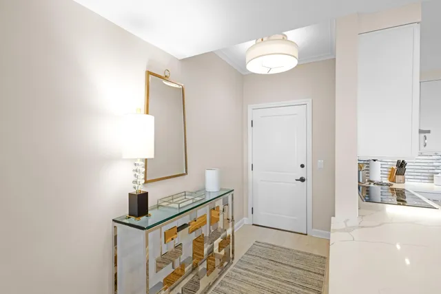 a view of hallway with wooden floor
