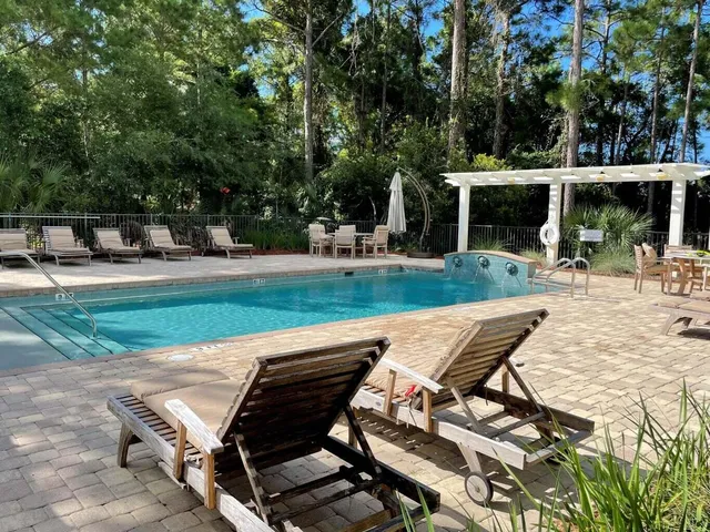a view of a backyard with sitting area