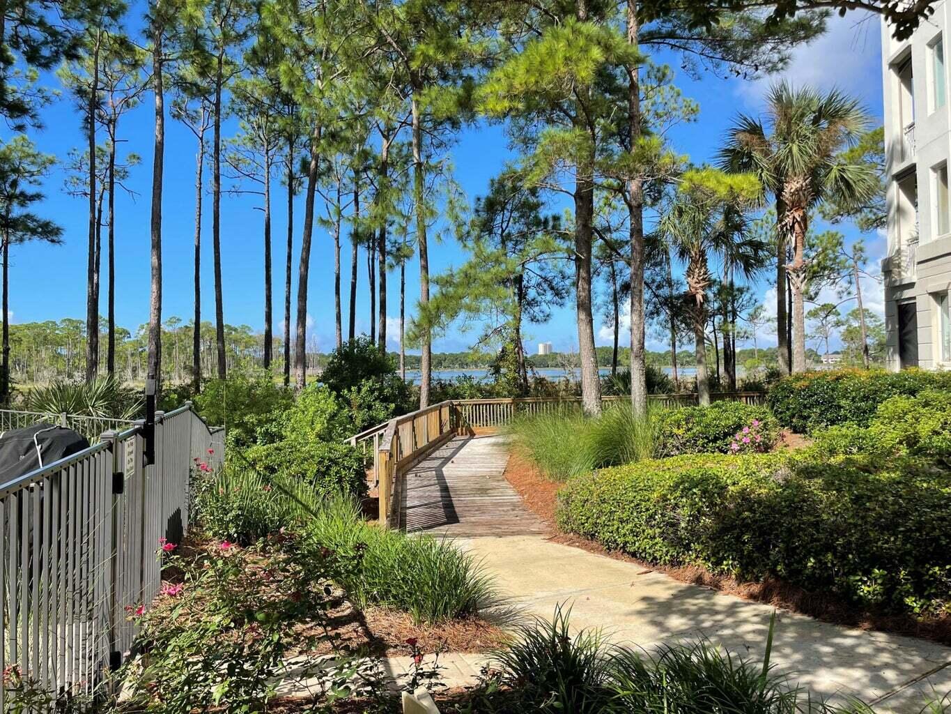 8708 Anchorage Drive Miramar Beach, FL 32550 - Photo 33 of 43 a view of a lake with a building in front of it