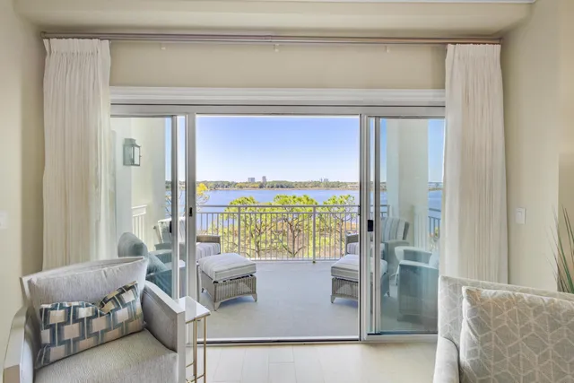 a view of living room with furniture and floor to ceiling window