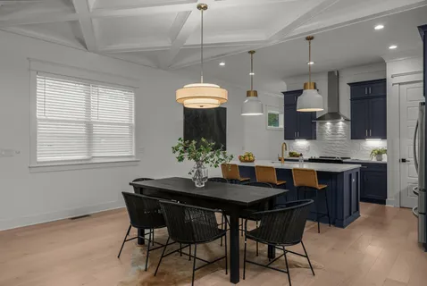 a kitchen with a table and chairs in it
