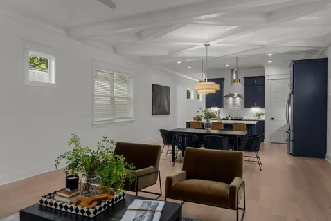a kitchen with a table and chairs in it