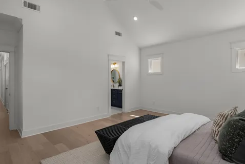 a bedroom with a bed and window