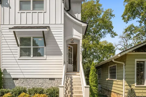 a view of a house with a tree