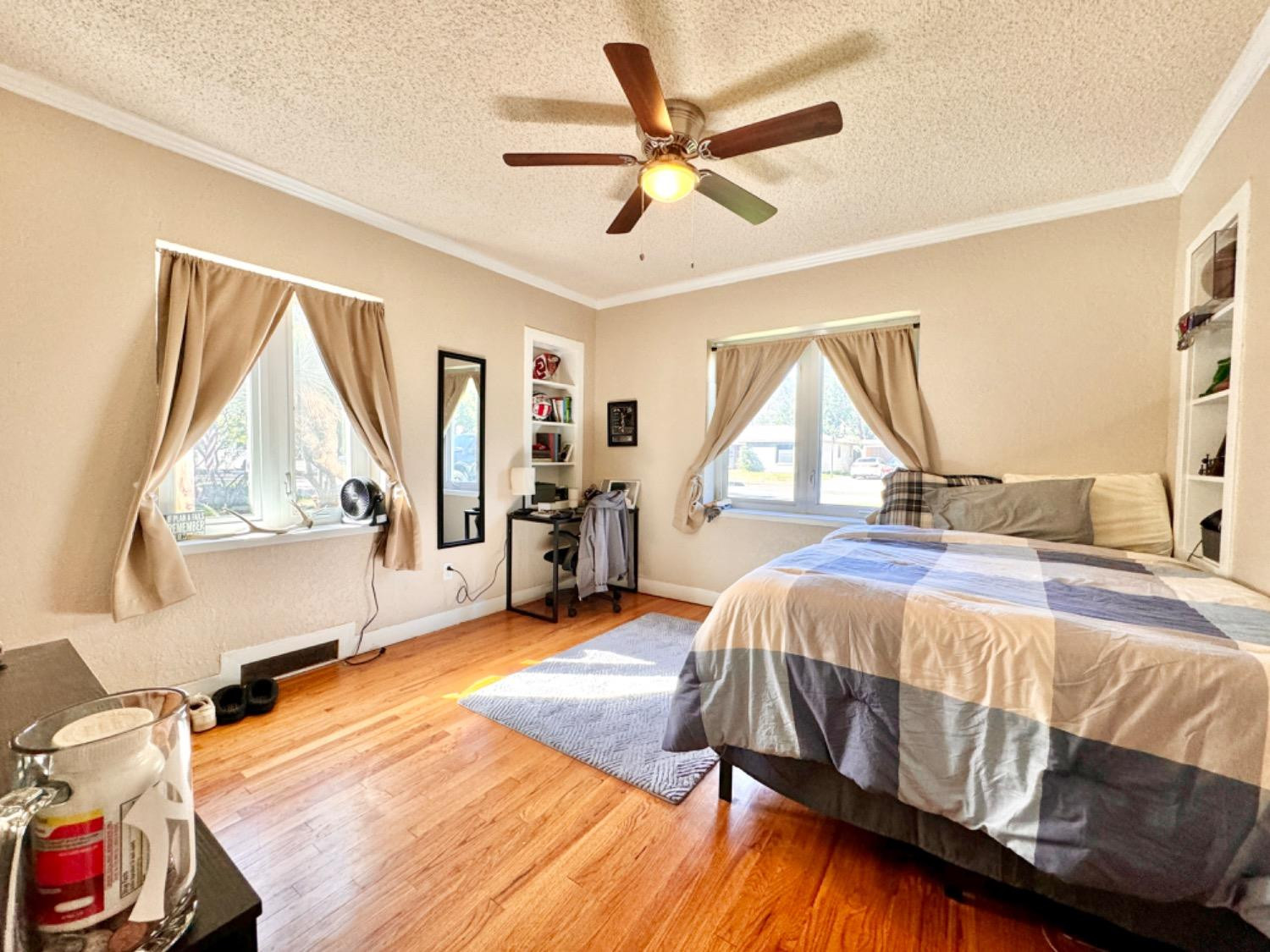 2621 23rd Street Lubbock, TX 79410 - Photo 15 of 38 a bedroom with a bed and a large window