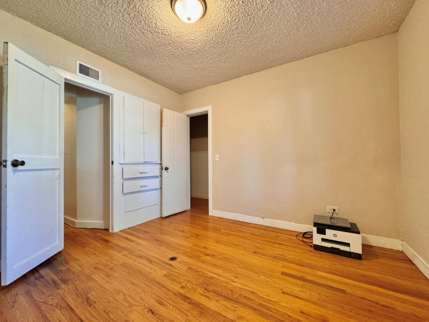 2621 23rd Street Lubbock, TX 79410 - Photo 23 of 38 a view of a room with wooden floor