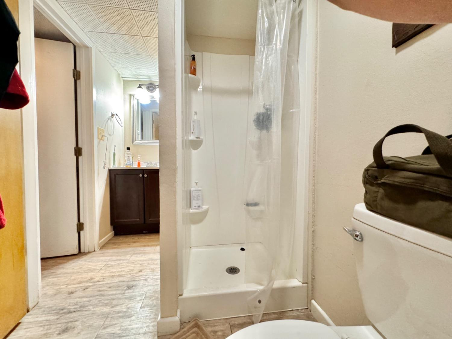 2621 23rd Street Lubbock, TX 79410 - Photo 31 of 38 a bathroom with a sink a toilet and shower
