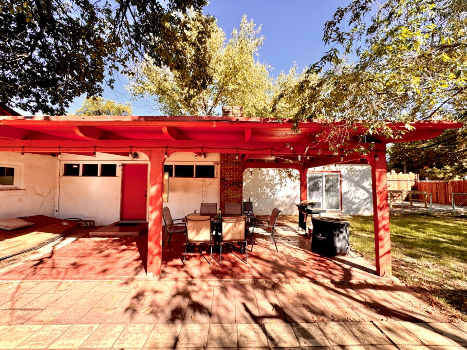 2621 23rd Street Lubbock, TX 79410 - Photo 36 of 38 a backyard of a house with barbeque oven table and chairs