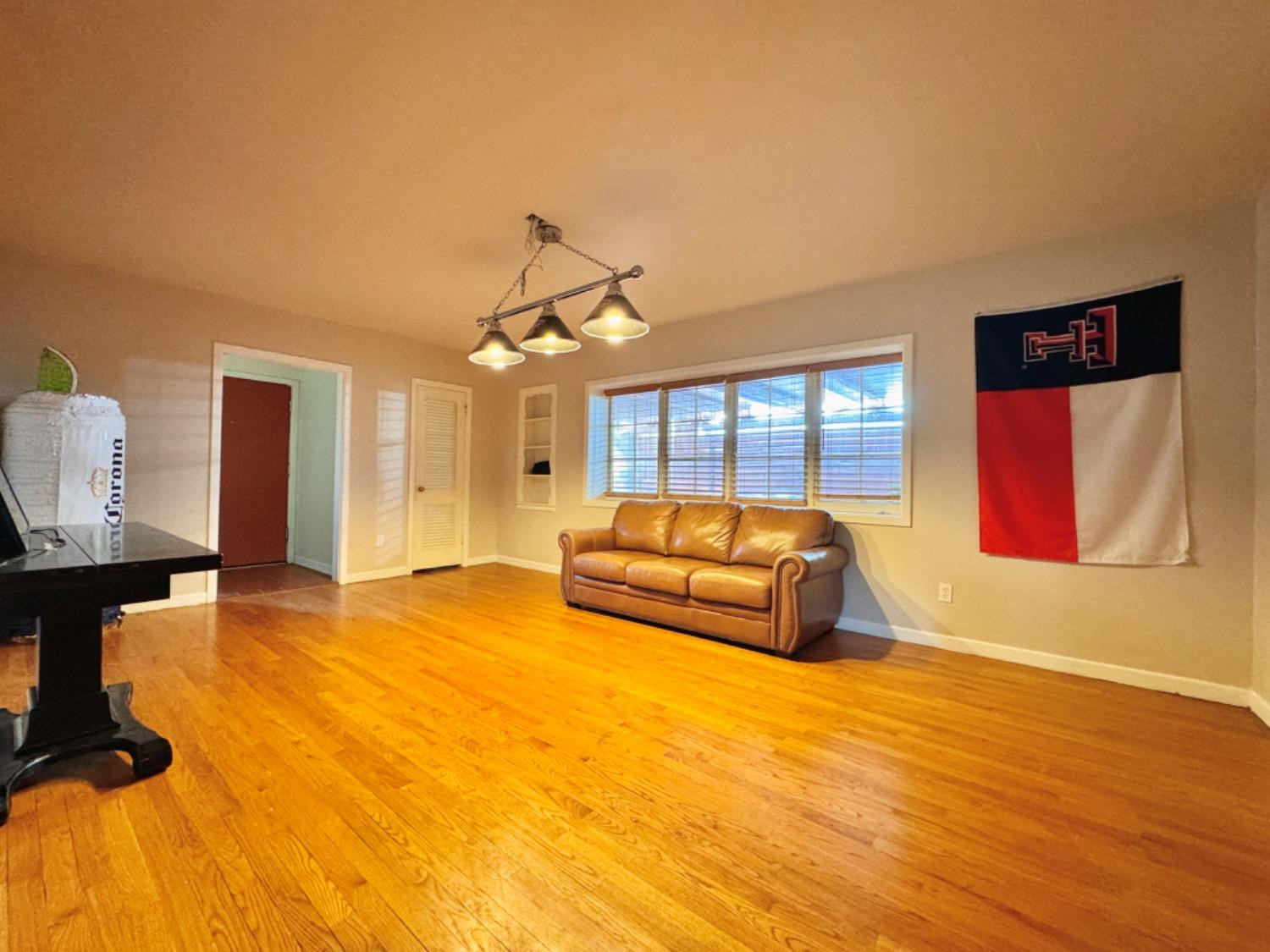 2621 23rd Street Lubbock, TX 79410 - Photo 6 of 38 a living room with furniture and a table