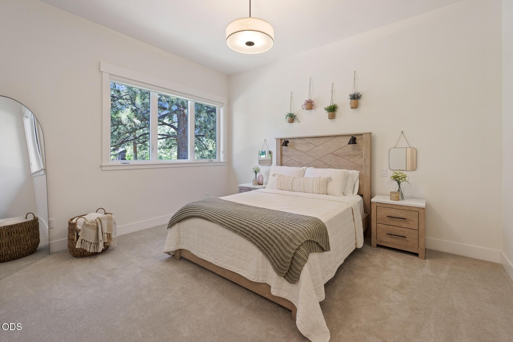 60255 Sunset View Drive Bend, OR 97702 - Photo 32 of 48 a bedroom with a bed and a window