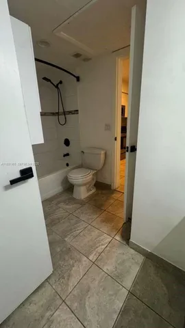 a kitchen with stainless steel appliances granite countertop a sink and a stove