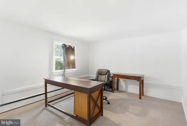 a workspace with furniture and window