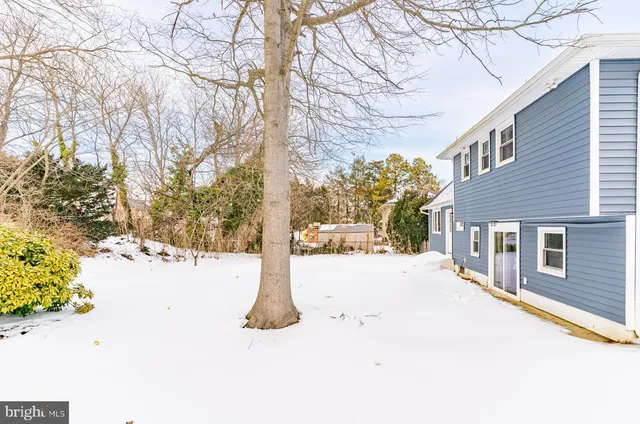 a view of a road with a snow in the yard