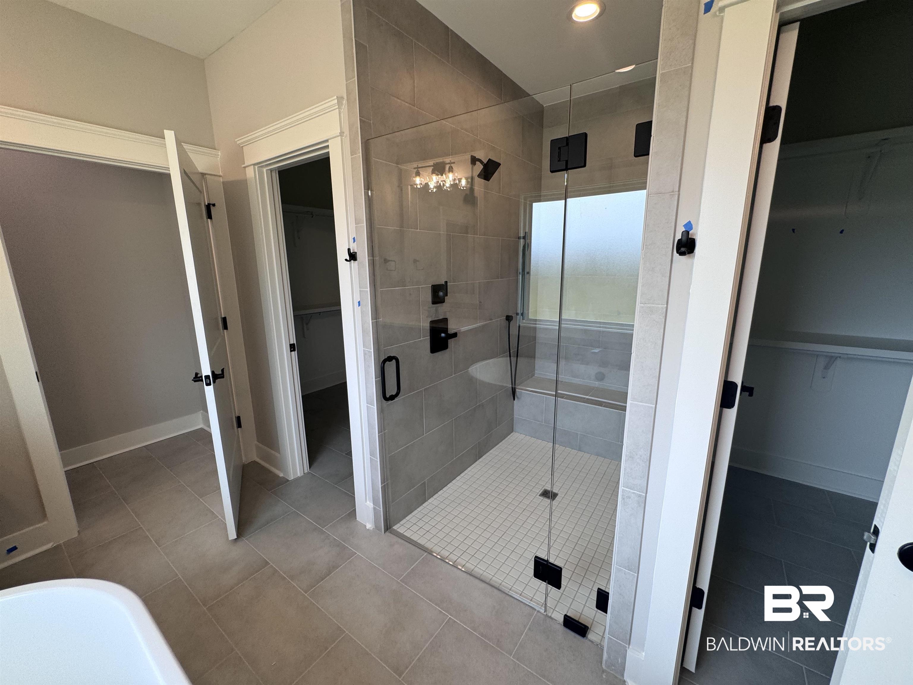 27371 Patch Pl Loop Daphne, AL 36526 - Photo 35 of 63 Full bath with a walk in closet, a stall shower, light tile patterned floors, and recessed lighting