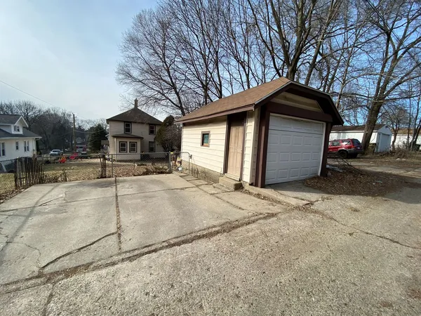 a house with trees in the background