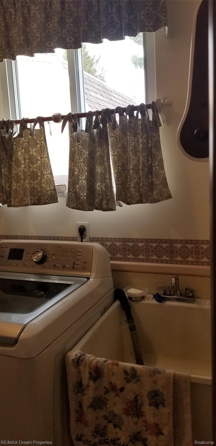 6533 Flintlock Ridge Utica, MI 48317 - Photo 16 of 53 LARGE FIRST FLOOR LAUNDRY ROOM HAS WINDOW AND SEPARATE LAUNDRY SINK
