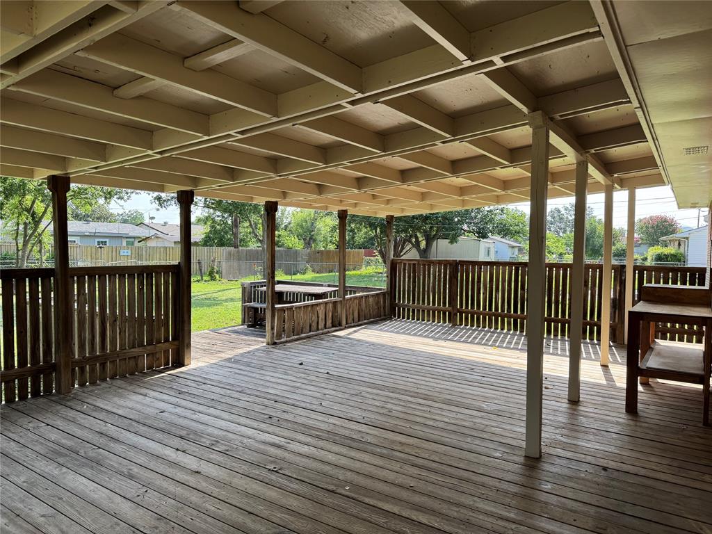 4513 Lawler Road Garland, TX 75042 - Photo 9 of 17 a view of a balcony with wooden floor