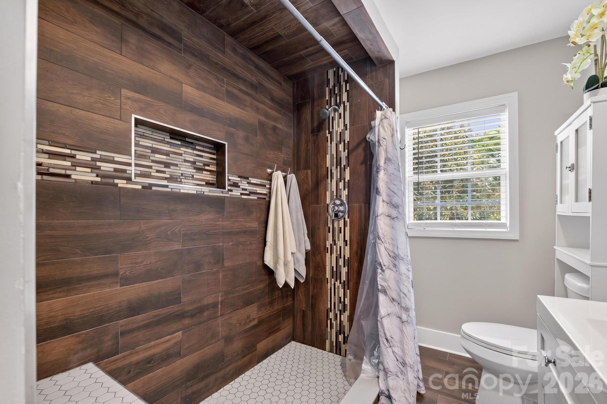 2076 Connelly Springs Road Lenoir, NC 28645 - Photo 24 of 47 a bathroom with a toilet and a shower