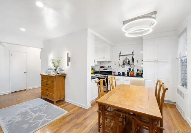 a view of a dining room with furniture and wooden floor