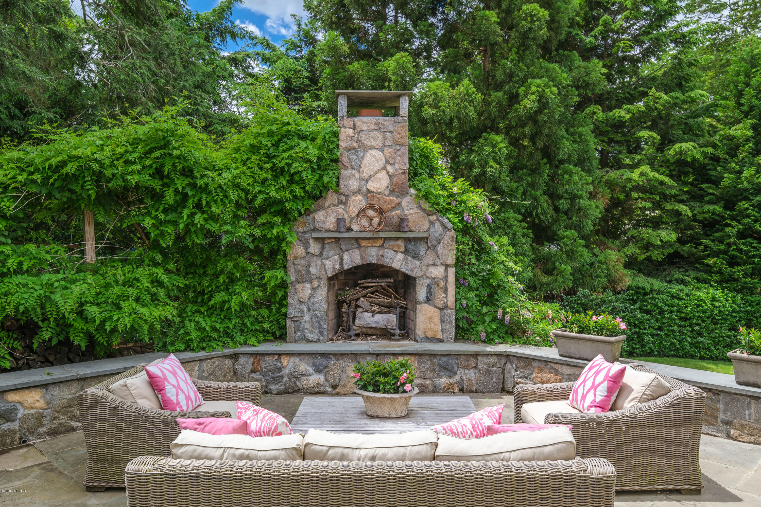 18 Tower Road Riverside, CT 06878 - Photo 17 of 27 a view of a patio with couches table and chairs and potted plants