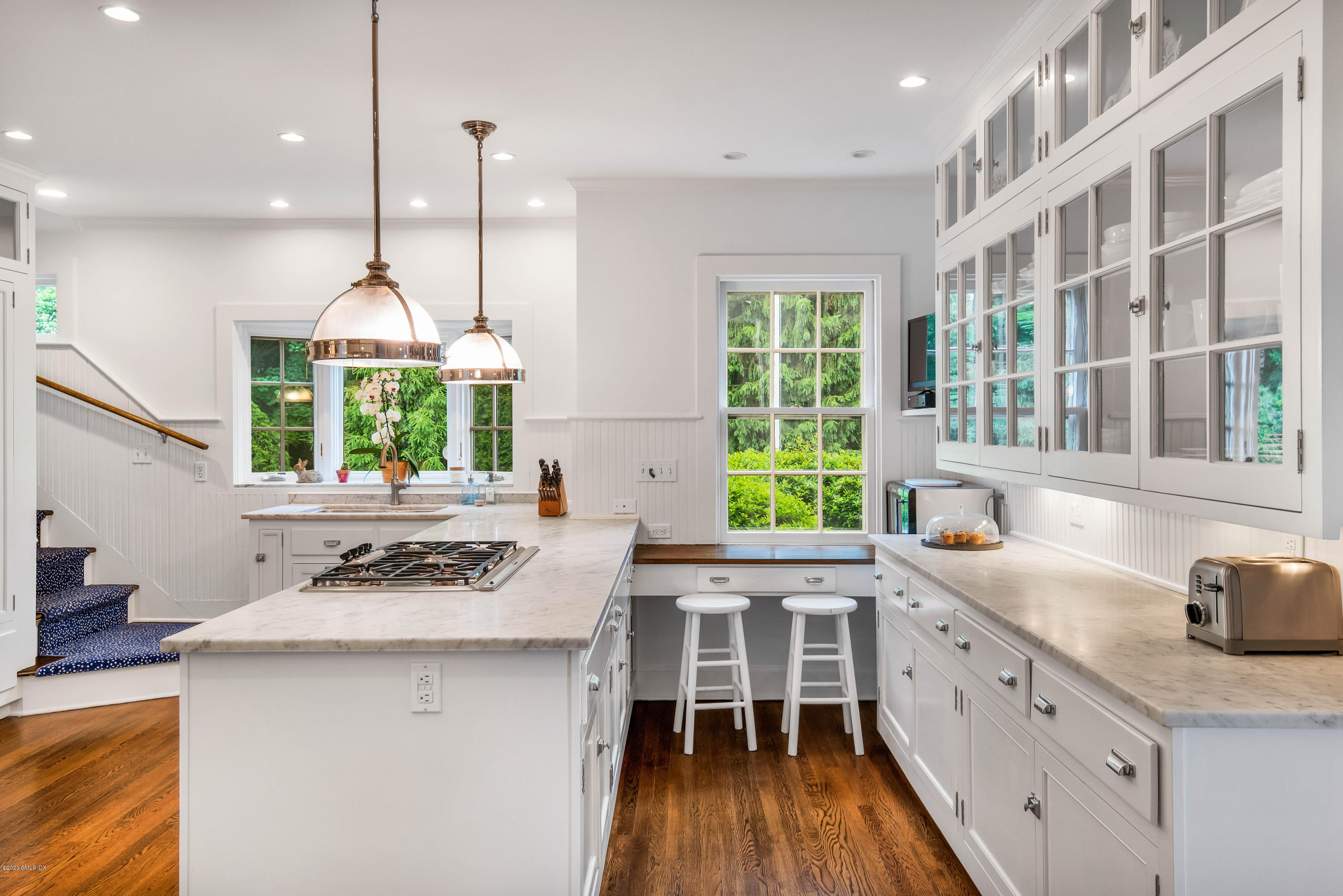 18 Tower Road Riverside, CT 06878 - Photo 8 of 27 a kitchen with stainless steel appliances a stove a sink dishwasher and a wooden cabinets