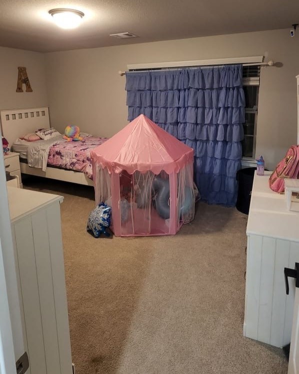 100 Wedgewood Trace Lane La Porte, TX 77571 - Photo 12 of 17 a bedroom with a bed and a dresser