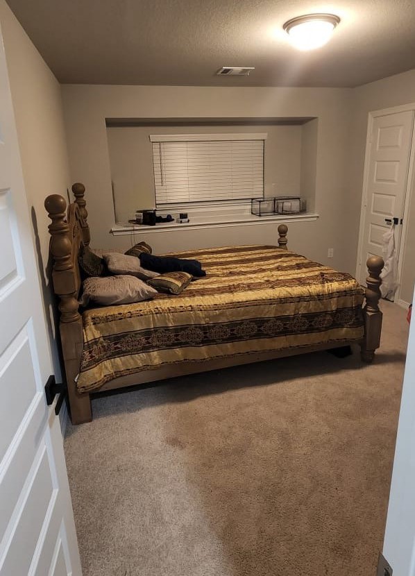 100 Wedgewood Trace Lane La Porte, TX 77571 - Photo 15 of 17 a bedroom with a bed and window