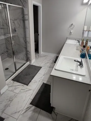a bathroom with a sink and mirror