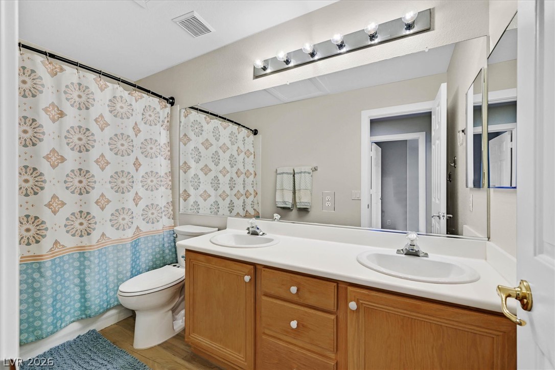 1259 Moon Vision Street Henderson, NV 89052 - Photo 29 of 53 Double vanity and a full-sized mirror create an optimal daily routine space.