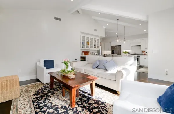 a living room with furniture and a lamp
