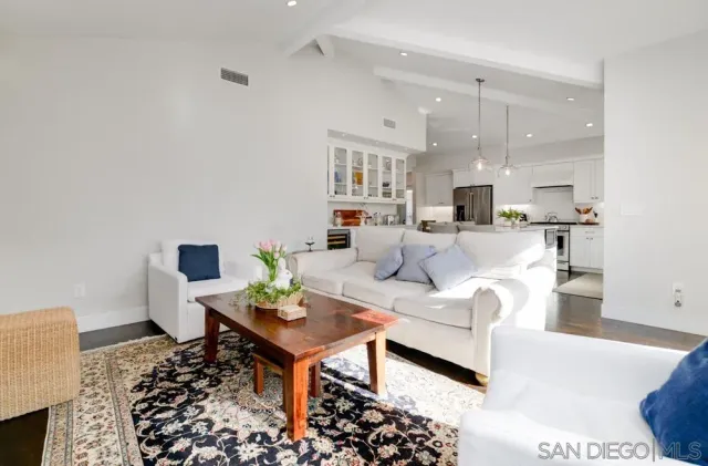 a living room with furniture and a lamp