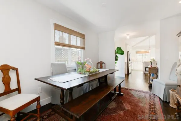 a view of a workspace with furniture and a potted plant