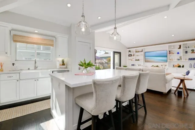a kitchen that has a table and chairs in it