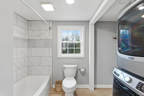 a bathroom with a toilet a sink and a shower