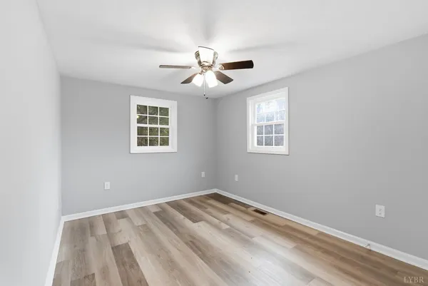 a view of room with window and ceiling fan
