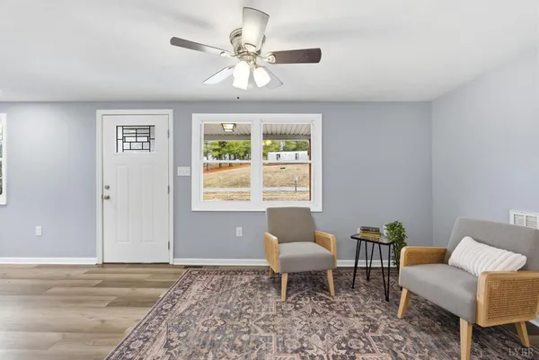 a living room with furniture and a window